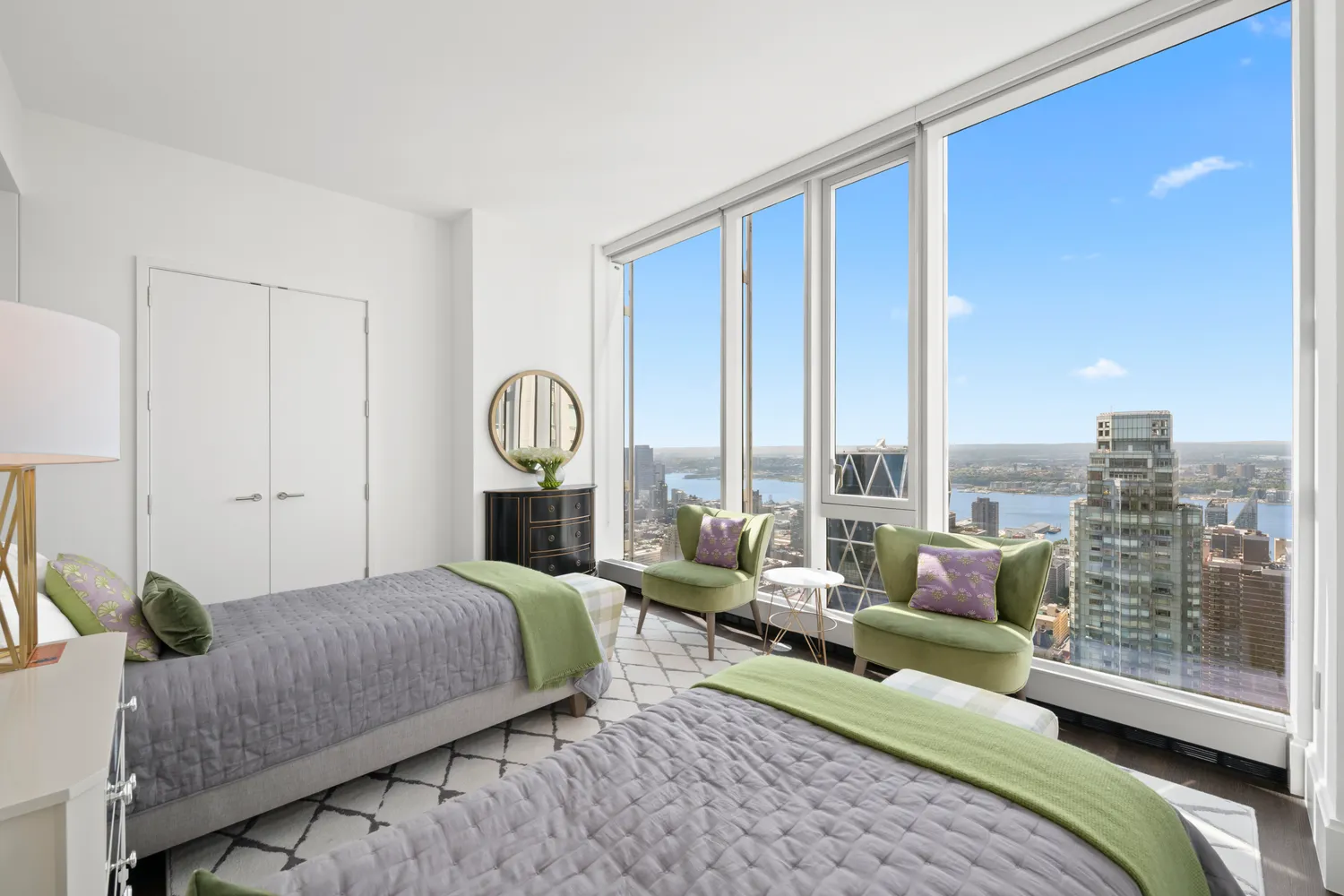 a bedroom with a bed large window and walk in closet