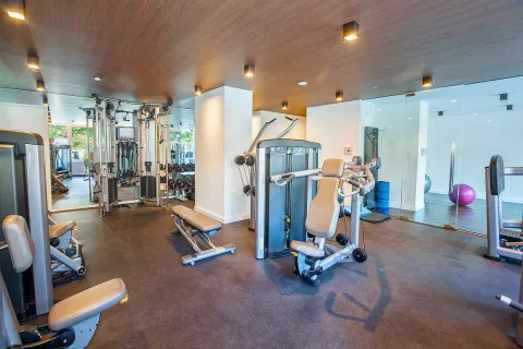 a bedroom with furniture and a large window