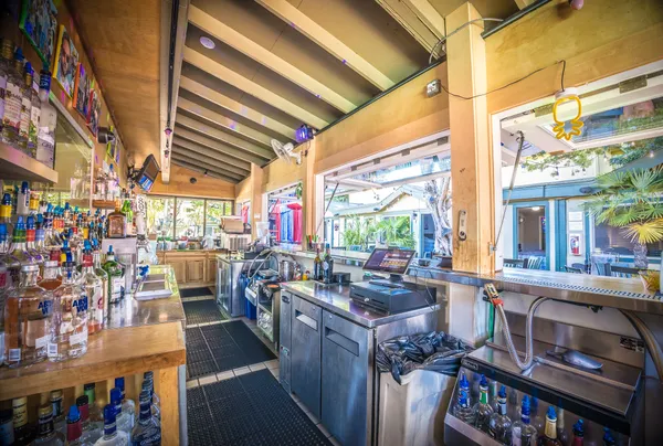 a bathroom with a sink a toilet a mirror and shower