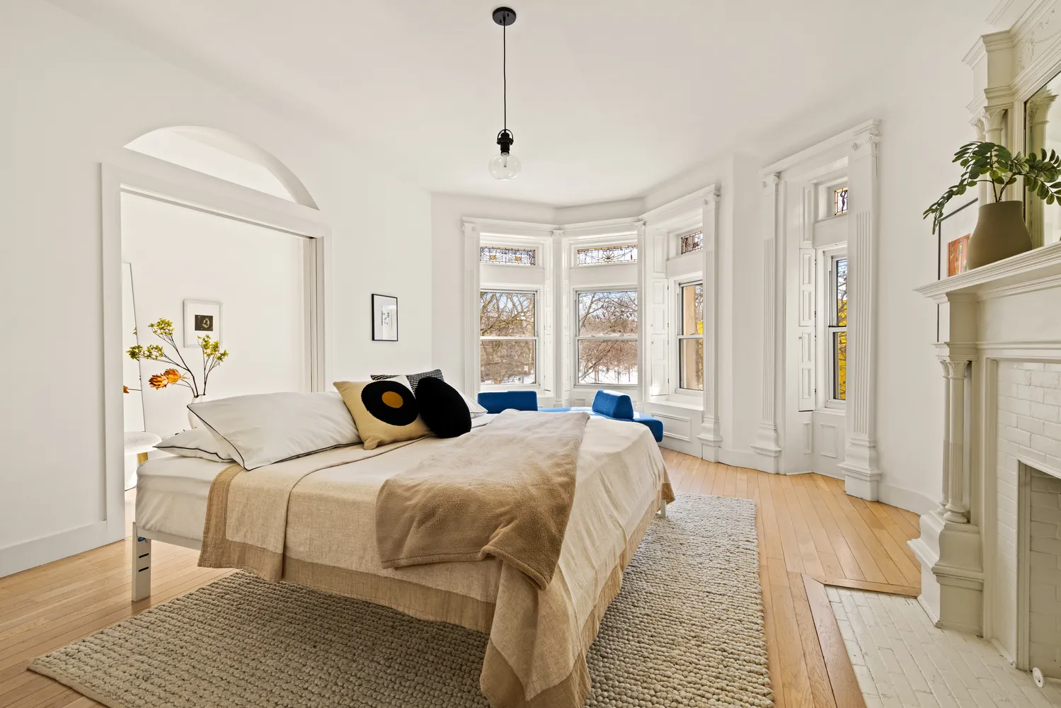 a bedroom with double bed and a window