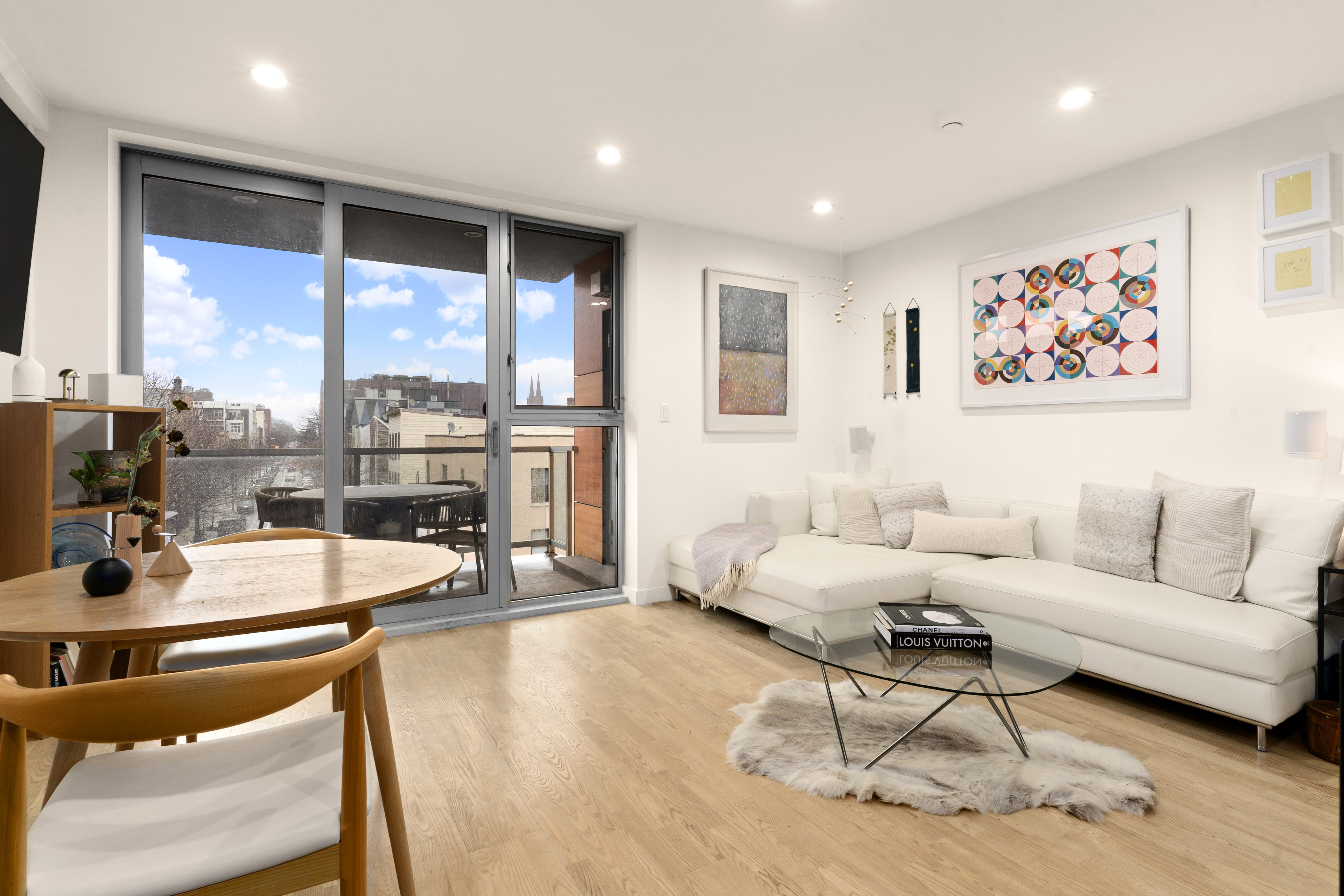 261 Union Avenue, Unit 4 Brooklyn, NY 11211 - Photo 1 of 13 a living room with furniture and a large window