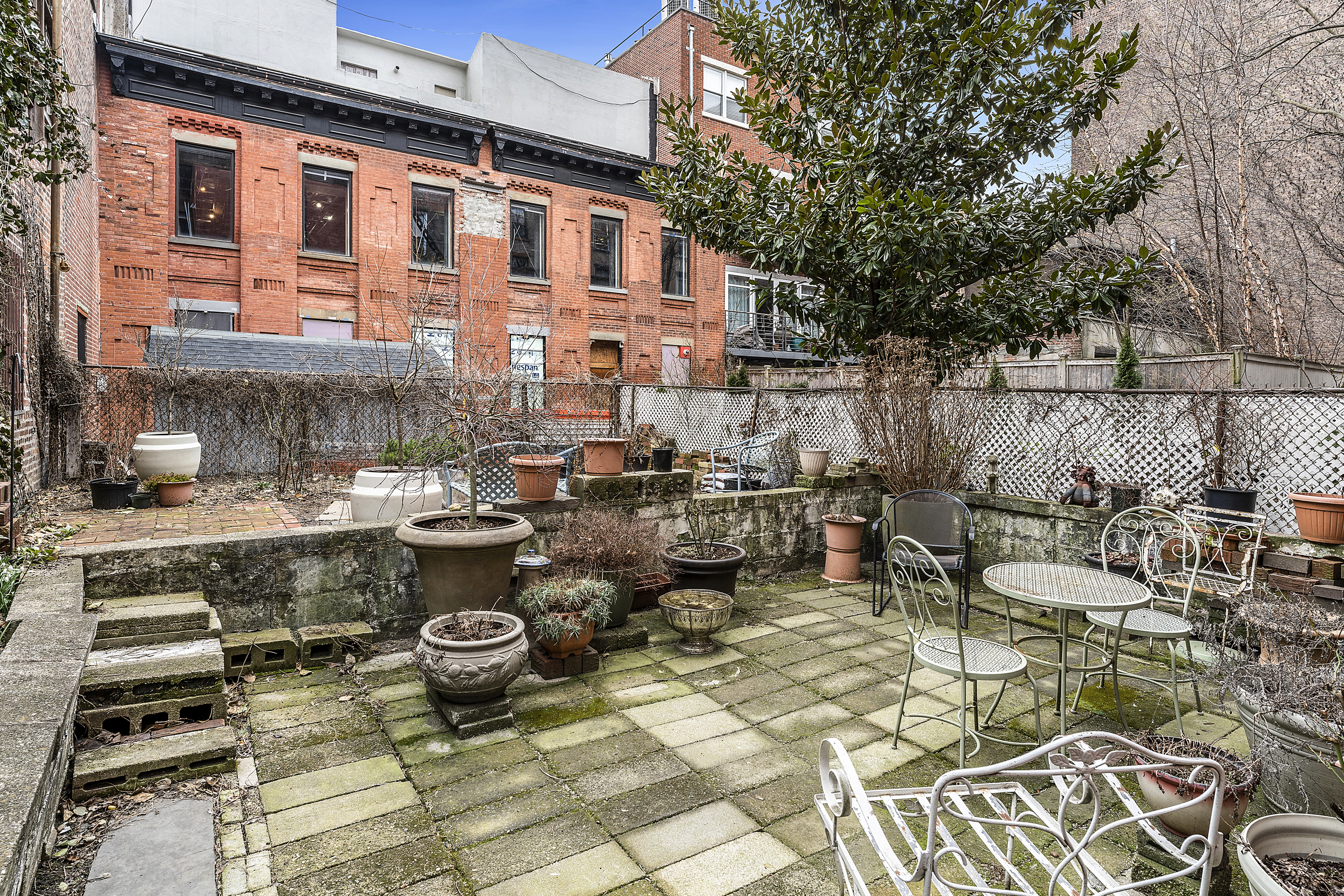 419 Clinton Avenue Brooklyn, NY 11238 - Photo 10 of 19 a view of a patio with couches chairs and wooden floor