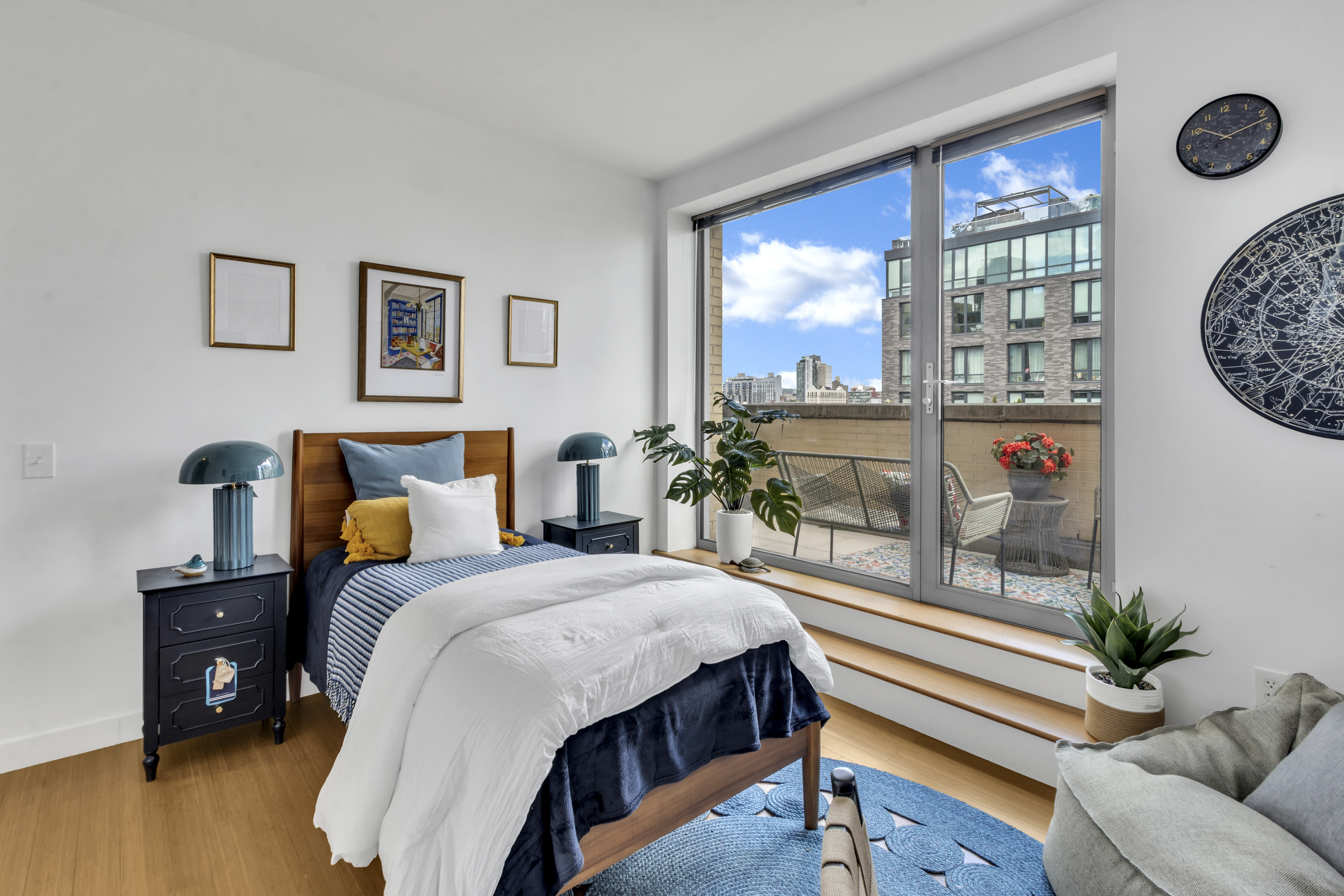 40 West 116th Street, Unit A907 Manhattan, NY 10026 - Photo 9 of 34 a bedroom with a bed and a table in it