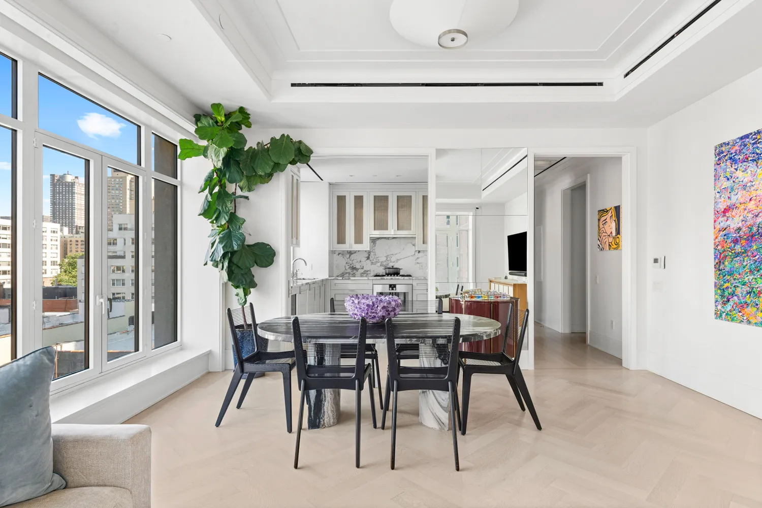 a view of a dining room with furniture and window