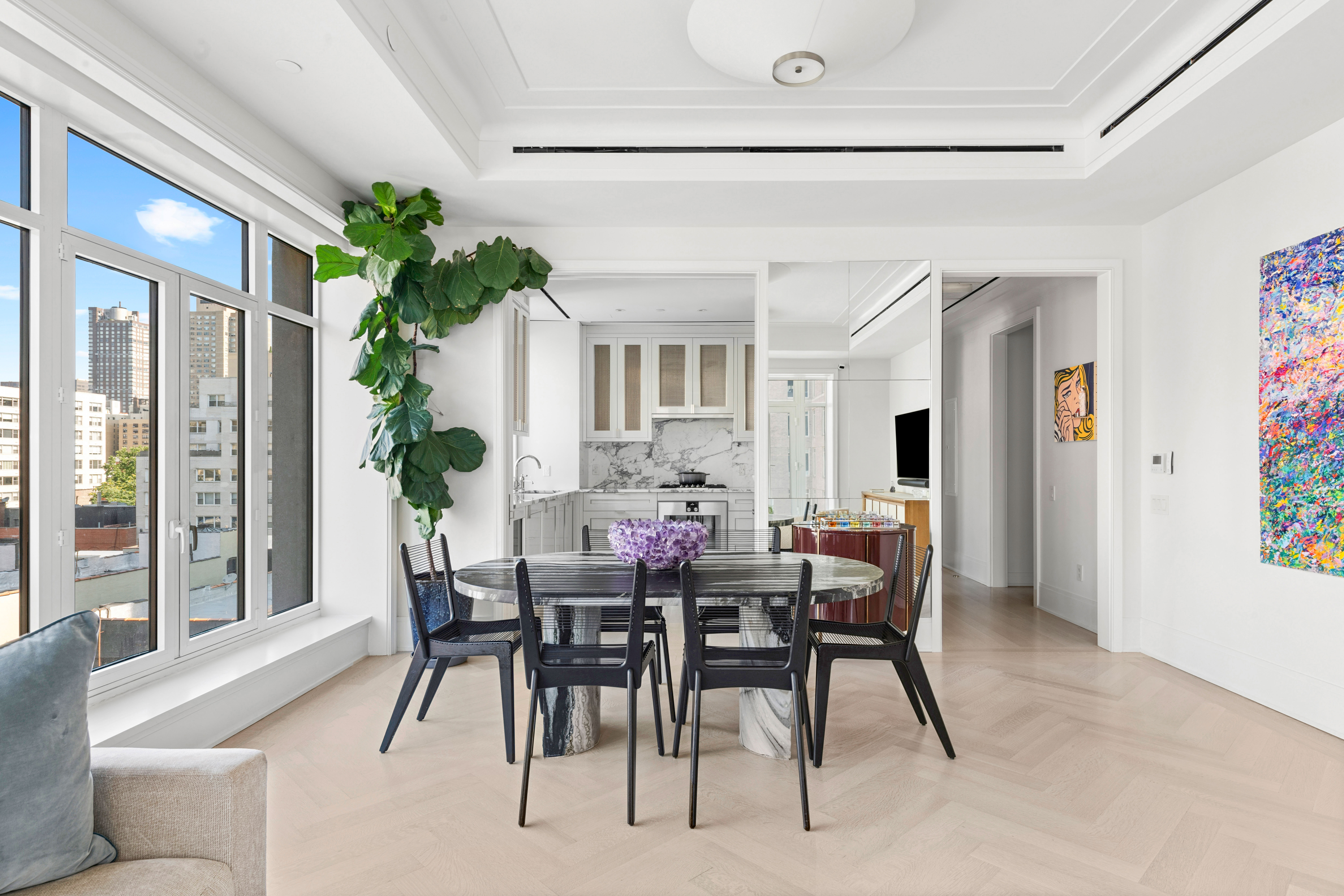 a view of a dining room with furniture and window