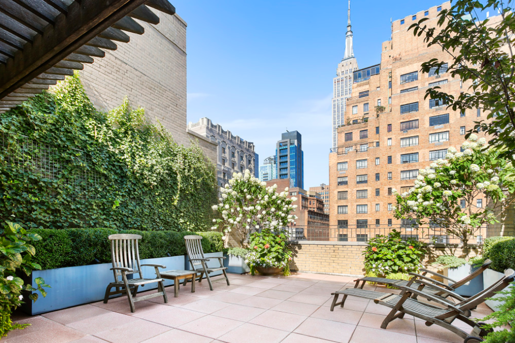 7 Park Avenue, Unit 2H Manhattan, NY 10016 - Photo 10 of 11 a view of a patio with a table and chairs and potted plants