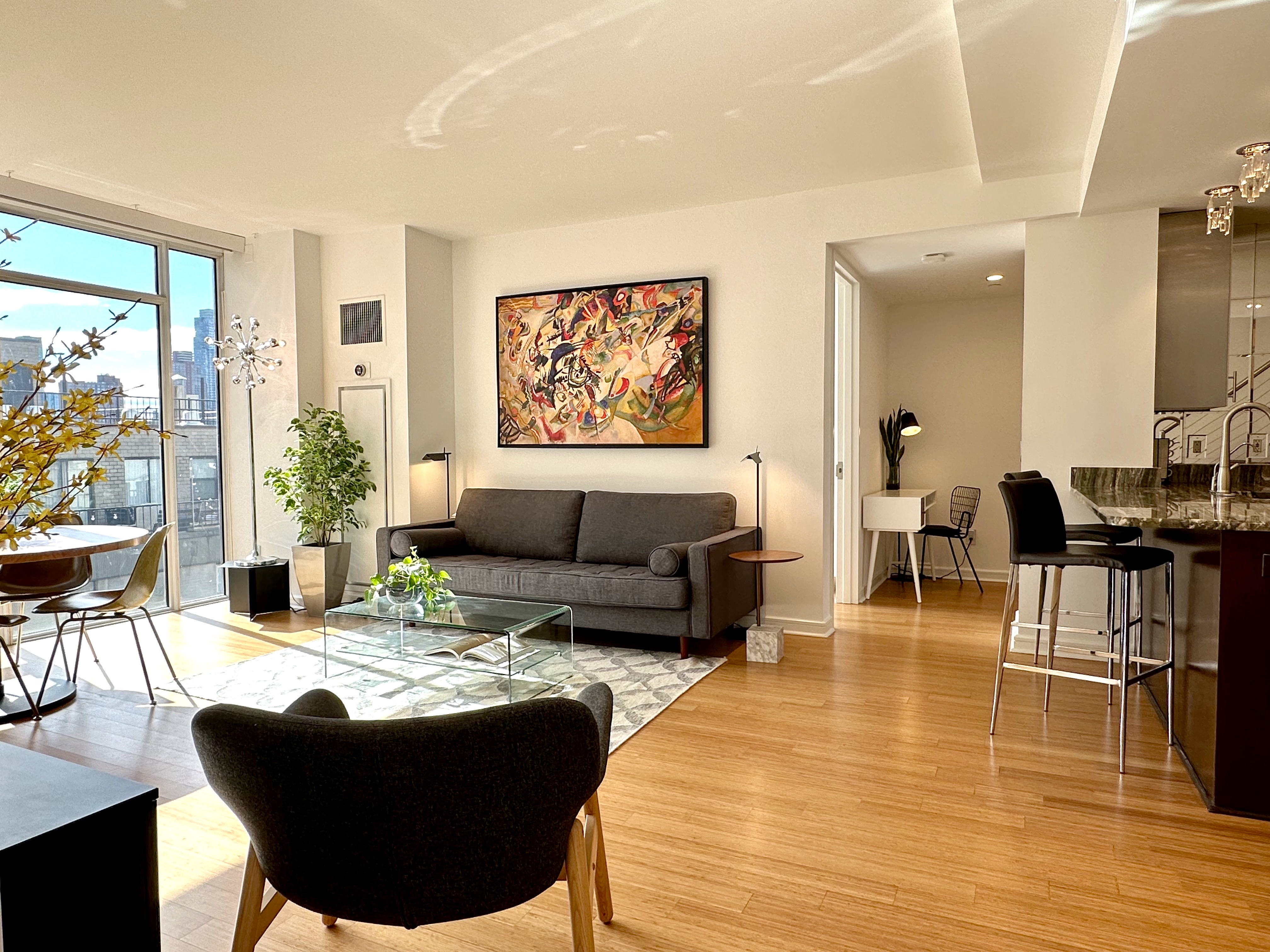 350 West 53rd Street, Unit PHA Manhattan, NY 10019 - Photo 4 of 35 a living room with furniture and a table