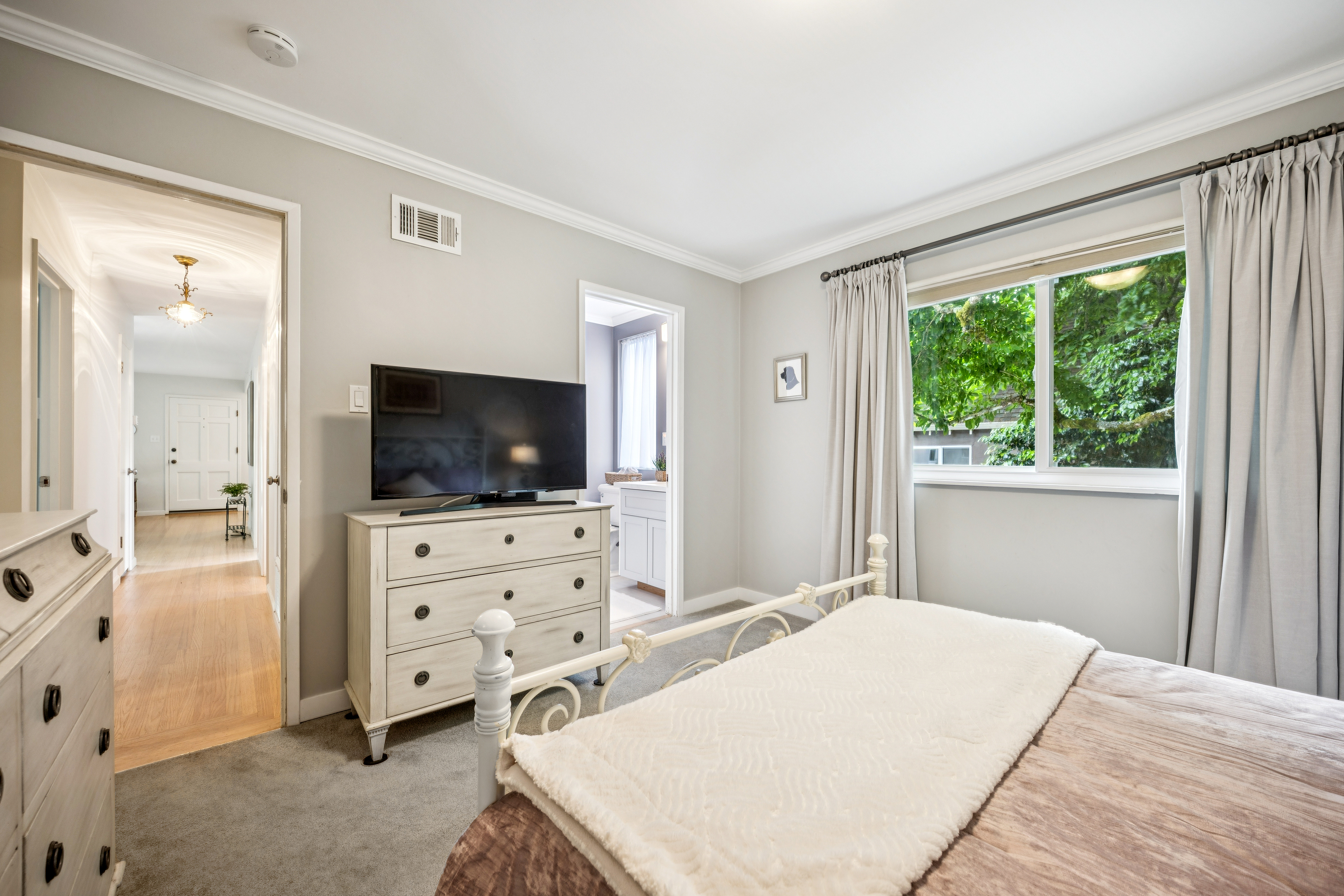 77 Bothin Road Fairfax, CA 94930 - Photo 15 of 32 a bedroom with a bed and a flat screen tv