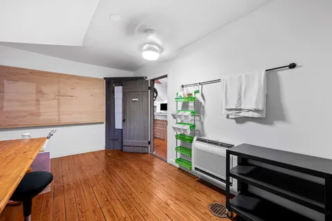 a kitchen with stainless steel appliances kitchen island granite countertop a sink and cabinets