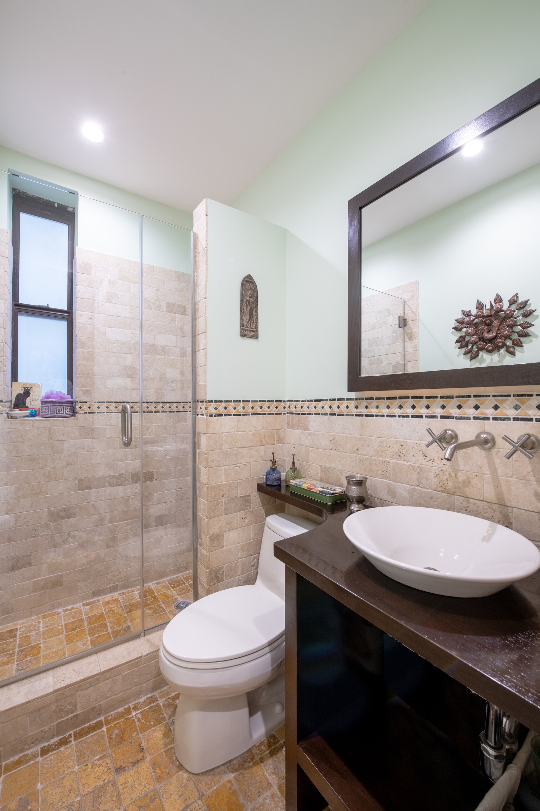 1809 Adam Clayton Powell Jr Boulevard, Unit 5C Manhattan, NY 10026 - Photo 9 of 11 a bathroom with a sink a toilet and shower