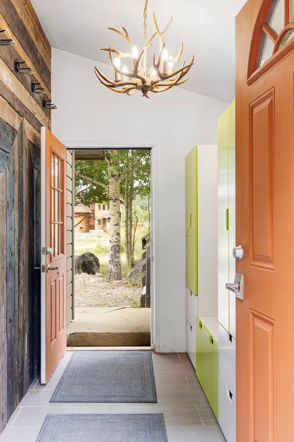 a view of entryway with a bathtub and door