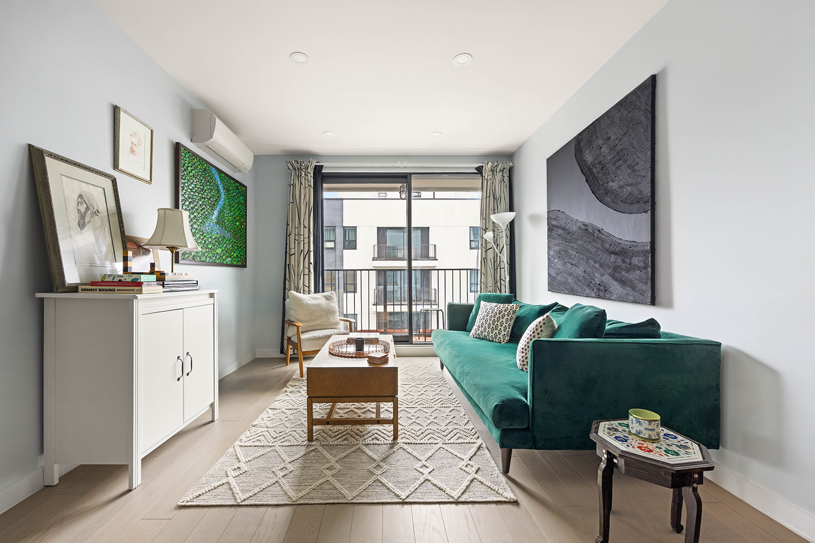 511 Evergreen Avenue, Unit 3D Brooklyn, NY 11221 - Photo 2 of 8 a living room with furniture and a flat screen tv