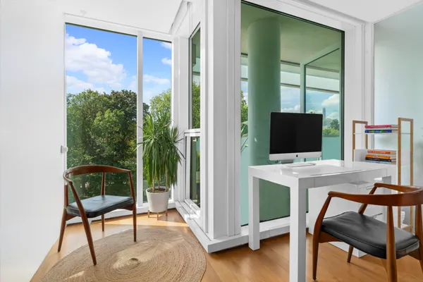 a workspace with furniture and a window