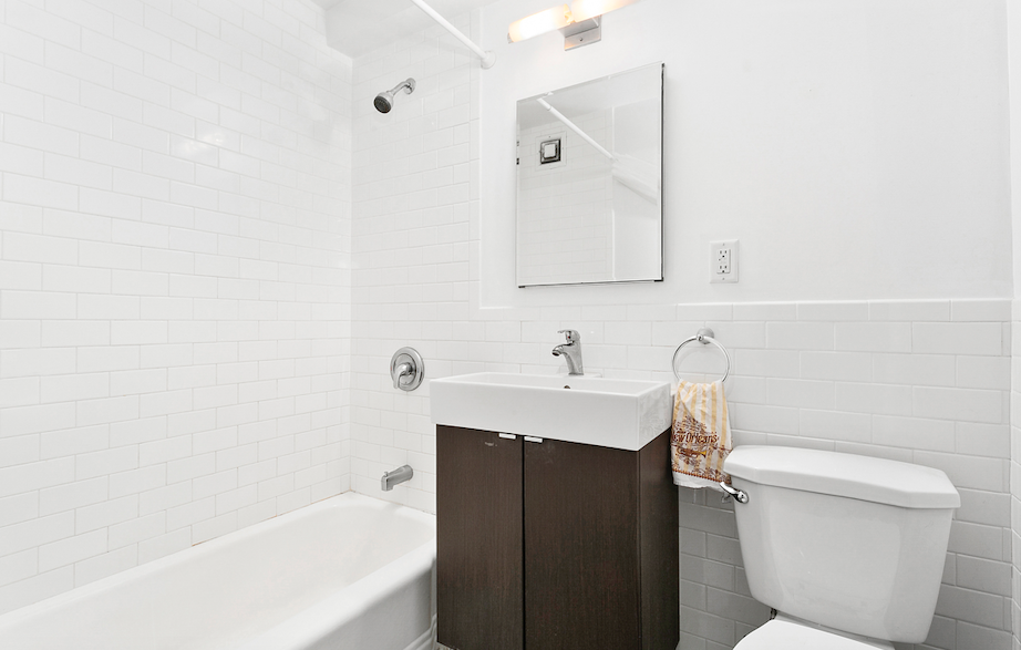 54 Orange Street, Unit 6D Brooklyn, NY 11201 - Photo 4 of 9 a bathroom with a sink a toilet and bathtub