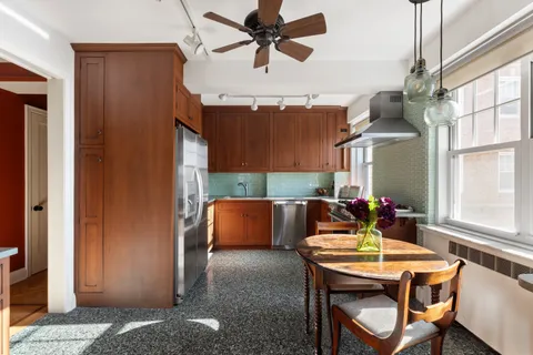 a dining room with furniture and window