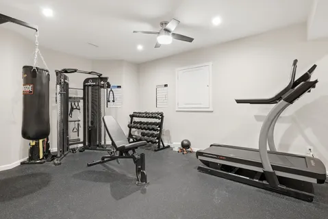 a spacious bedroom with a bed and a window