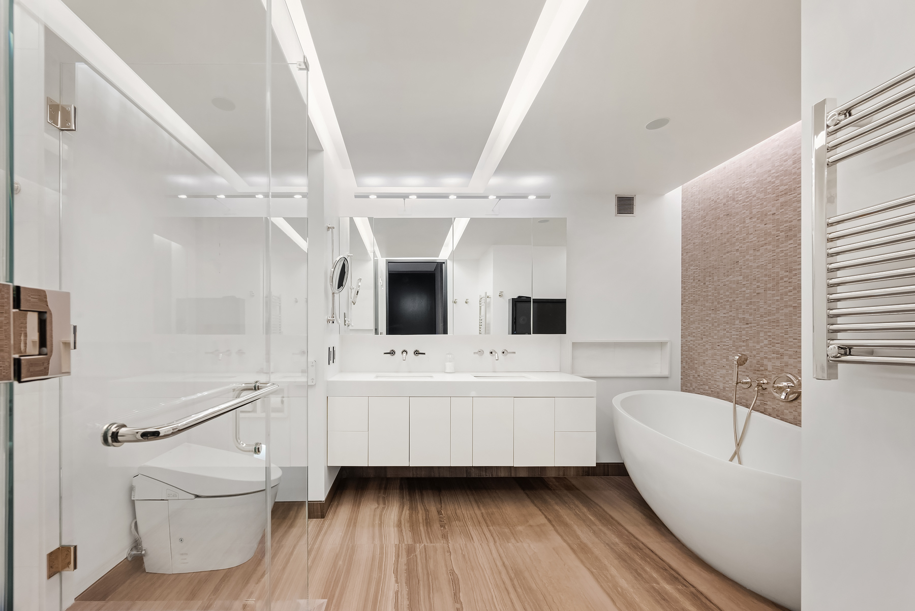 279 Central Park West, Unit 8B Manhattan, NY 10024 - Photo 6 of 15 a spacious bathroom with a bathtub a toilet a sink and a large mirror