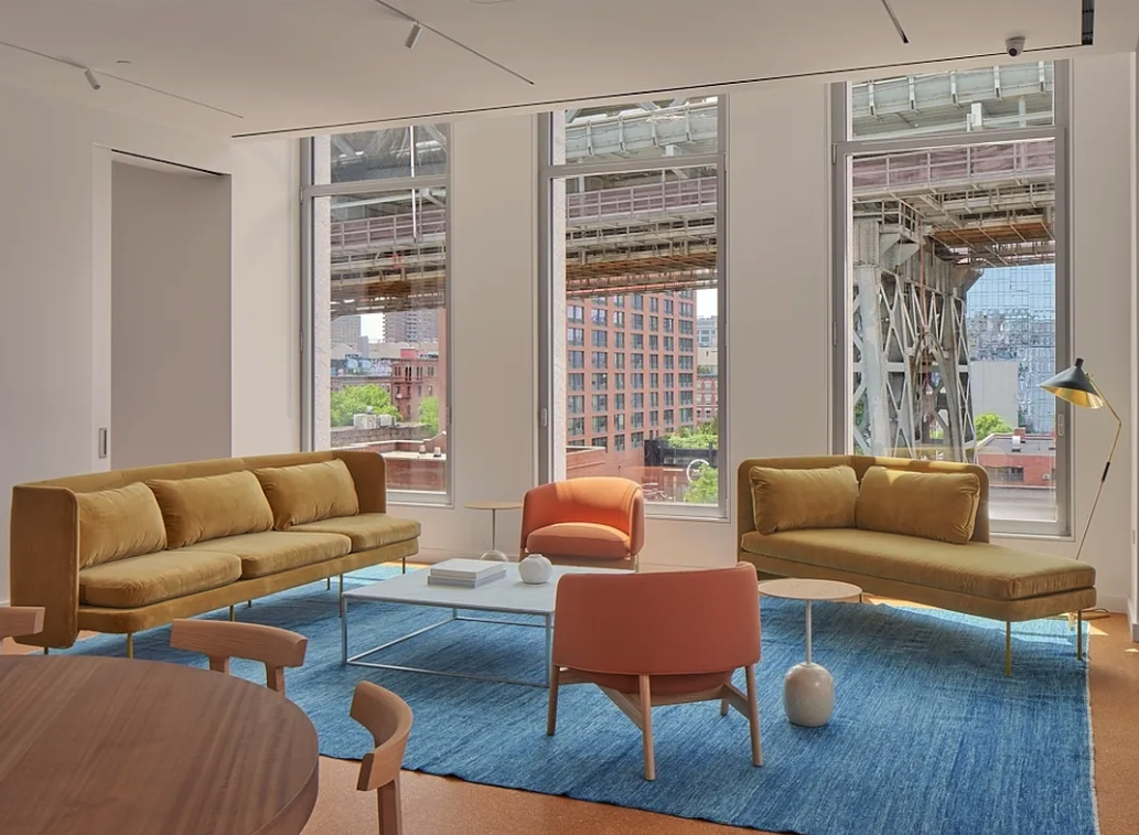 5 South 5th Street, Unit 913 Brooklyn, NY 11249 - Photo 19 of 24 a living room with furniture and a large window