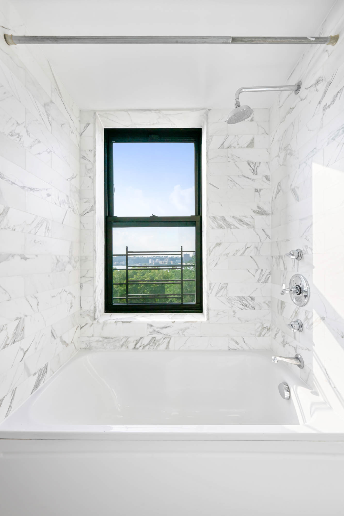 230 Riverside Drive, Unit 8D Manhattan, NY 10025 - Photo 10 of 19 a bathroom with a bathtub and shower