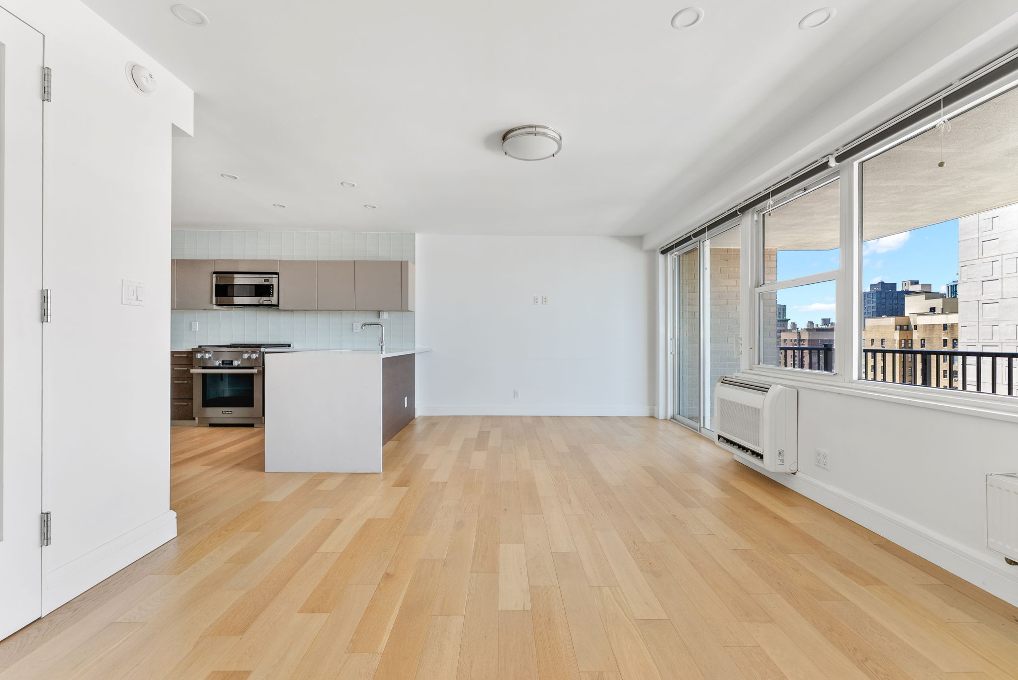 175 West 95th Street, Unit 15D Manhattan, NY 10025 - Photo 1 of 13 a view of a kitchen with a sink and a refrigerator