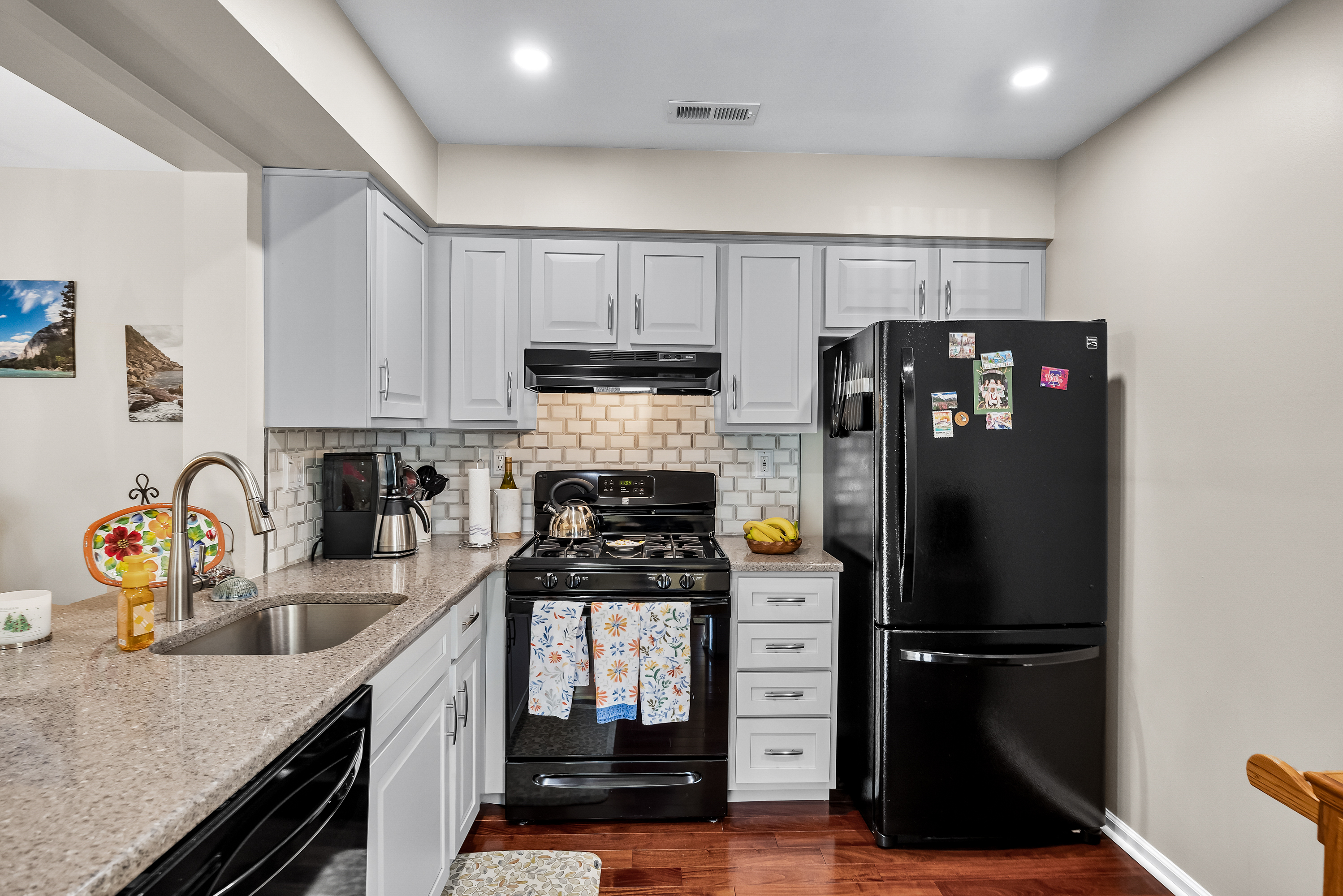 1007 A Yarmouth Lane Mount Laurel, NJ 08054 - Photo 8 of 27 a kitchen with stainless steel appliances granite countertop a refrigerator a stove a sink dishwasher and a refrigerator with wooden cabinets