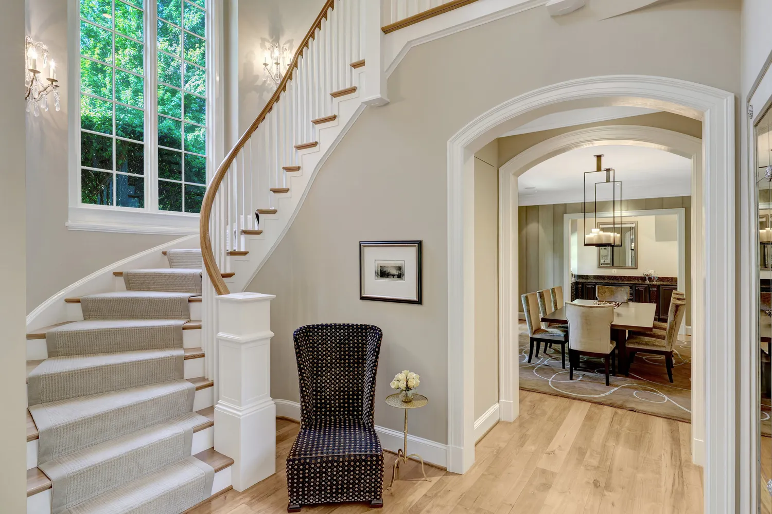 a living room with furniture and flowers