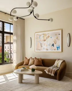 a room with lots of trees and furniture