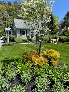 a front view of a house with garden