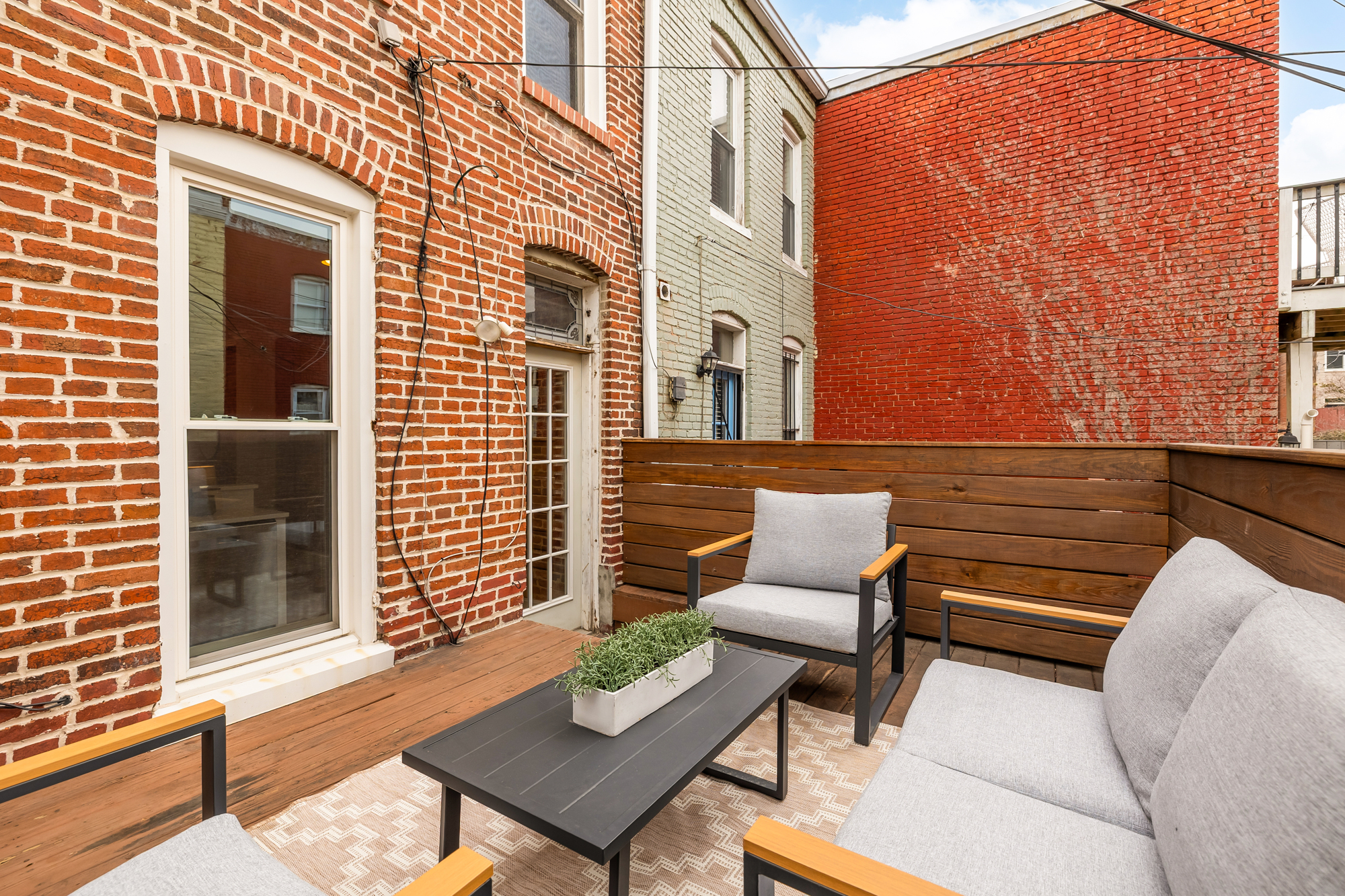 903 F Street Northeast Washington, DC 20002 - Photo 14 of 41 a view of a patio with couple of chairs and a couch