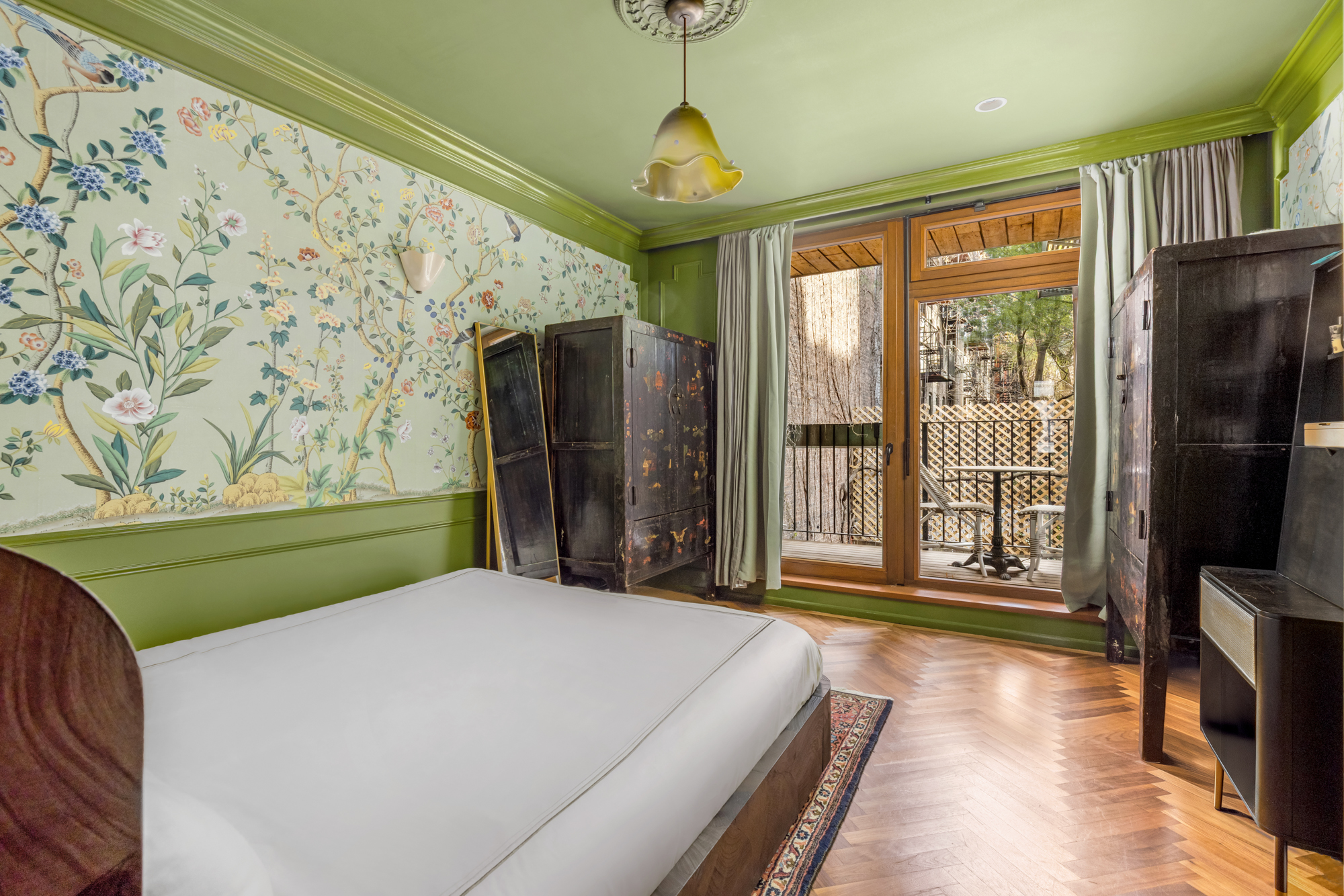 25 Prince Street, Unit 2A Manhattan, NY 10012 - Photo 7 of 11 a bedroom with a bed and a flat tv screen on dresser