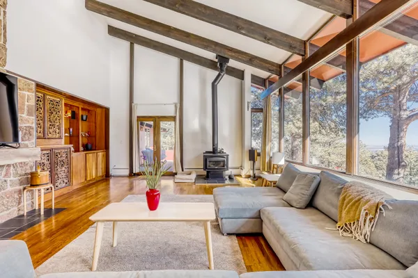 a living room with furniture fireplace and a flat screen tv