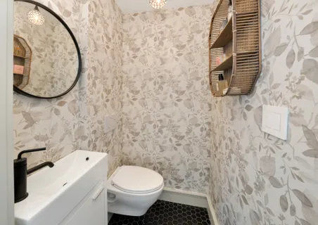 a bathroom with a toilet and a sink