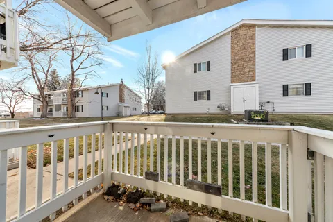 a view of a house with a small yard