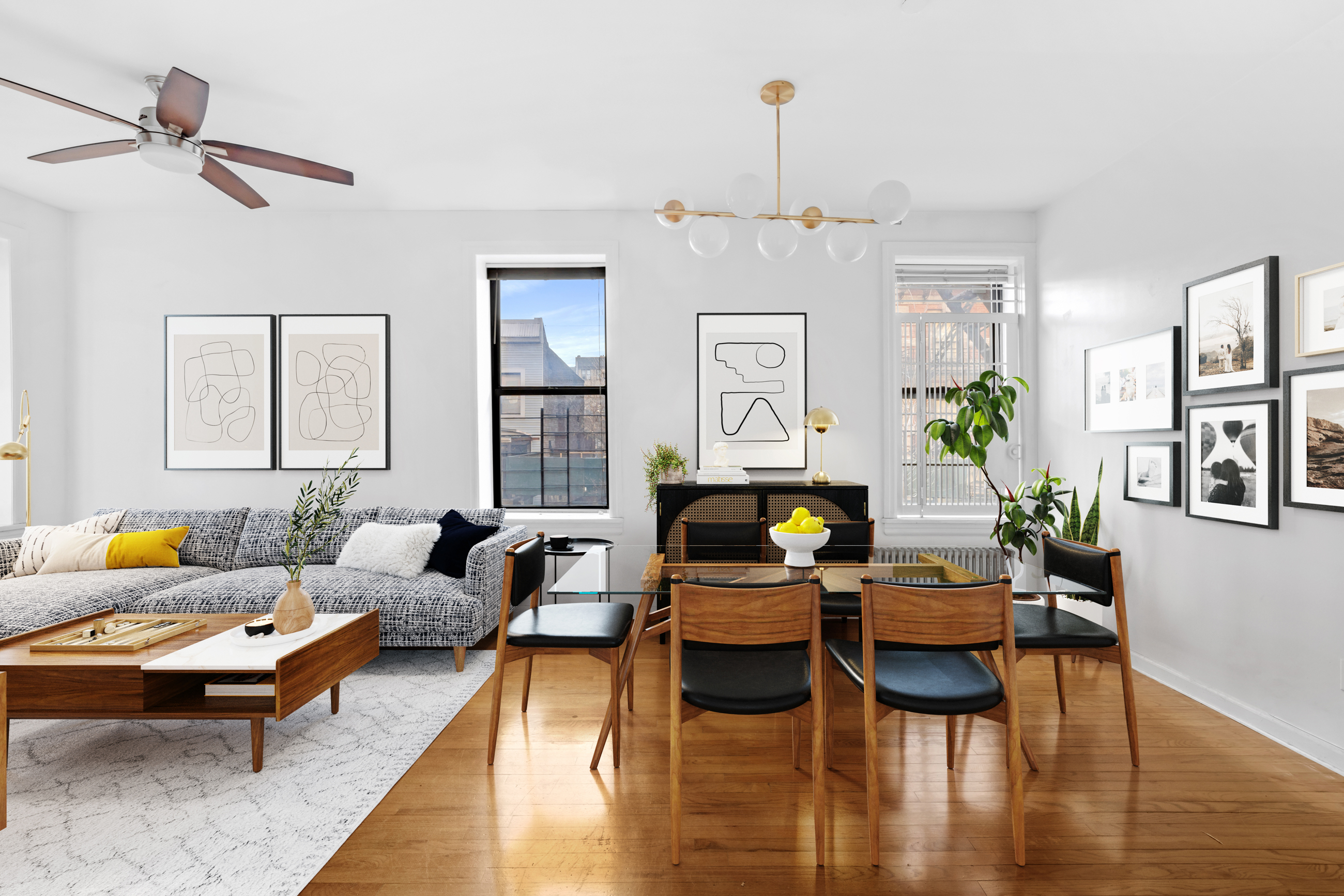 a living room with fireplace furniture and a wooden floor