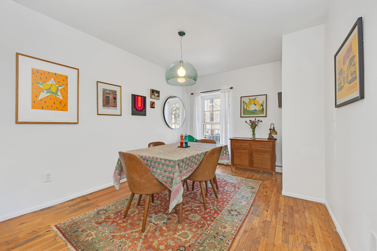 503 Clinton Street, Unit 1 Brooklyn, NY 11231 - Photo 3 of 16 a view of a dining room with furniture and wooden floor