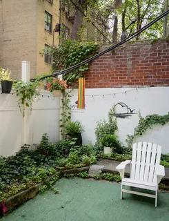a view of staircase with white walls and railing