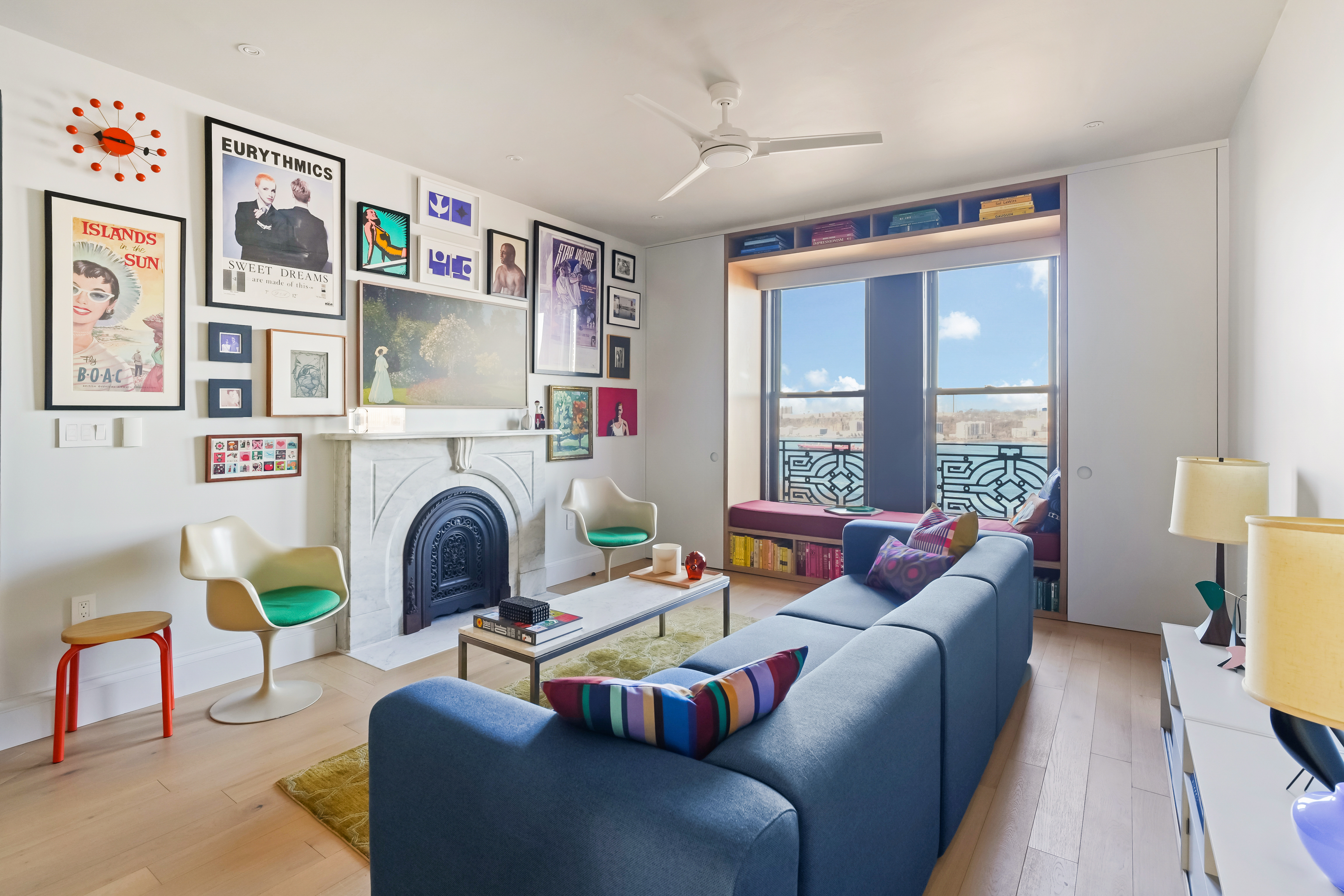 265 Riverside Drive, Unit 11F Manhattan, NY 10025 - Photo 1 of 16 a living room with furniture fireplace and a large window