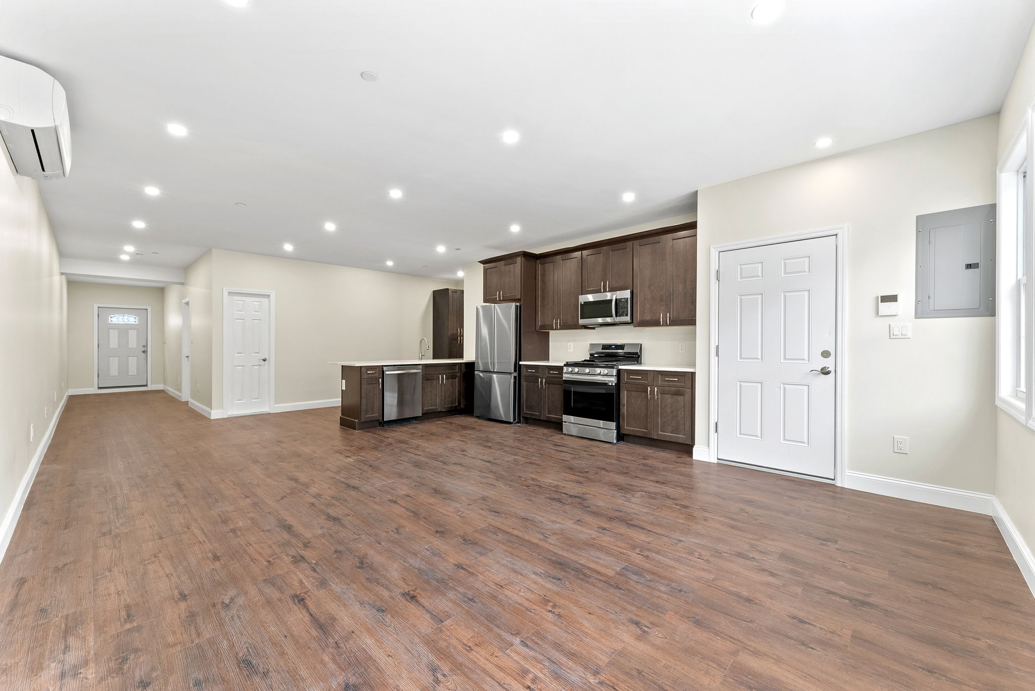 217 Butler Street, Unit 1 Brooklyn, NY 11217 - Photo 2 of 10 a large kitchen with stainless steel appliances kitchen island a large counter top and a stove top oven