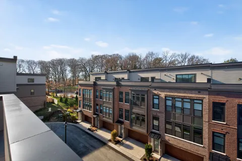 a view of a balcony with chairs