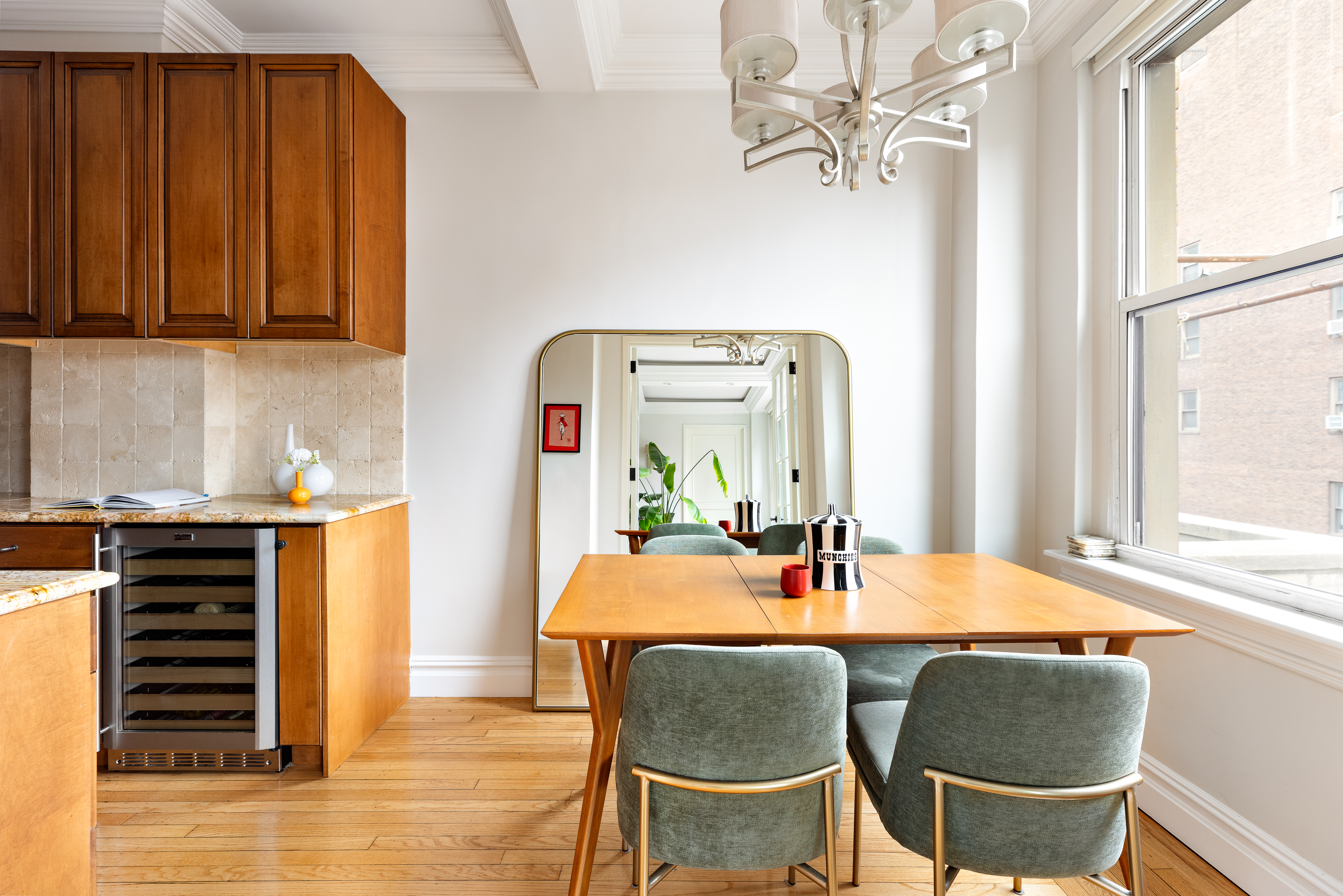 55 Park Avenue, Unit 9E Manhattan, NY 10016 - Photo 7 of 9 a dining room with furniture and wooden floor