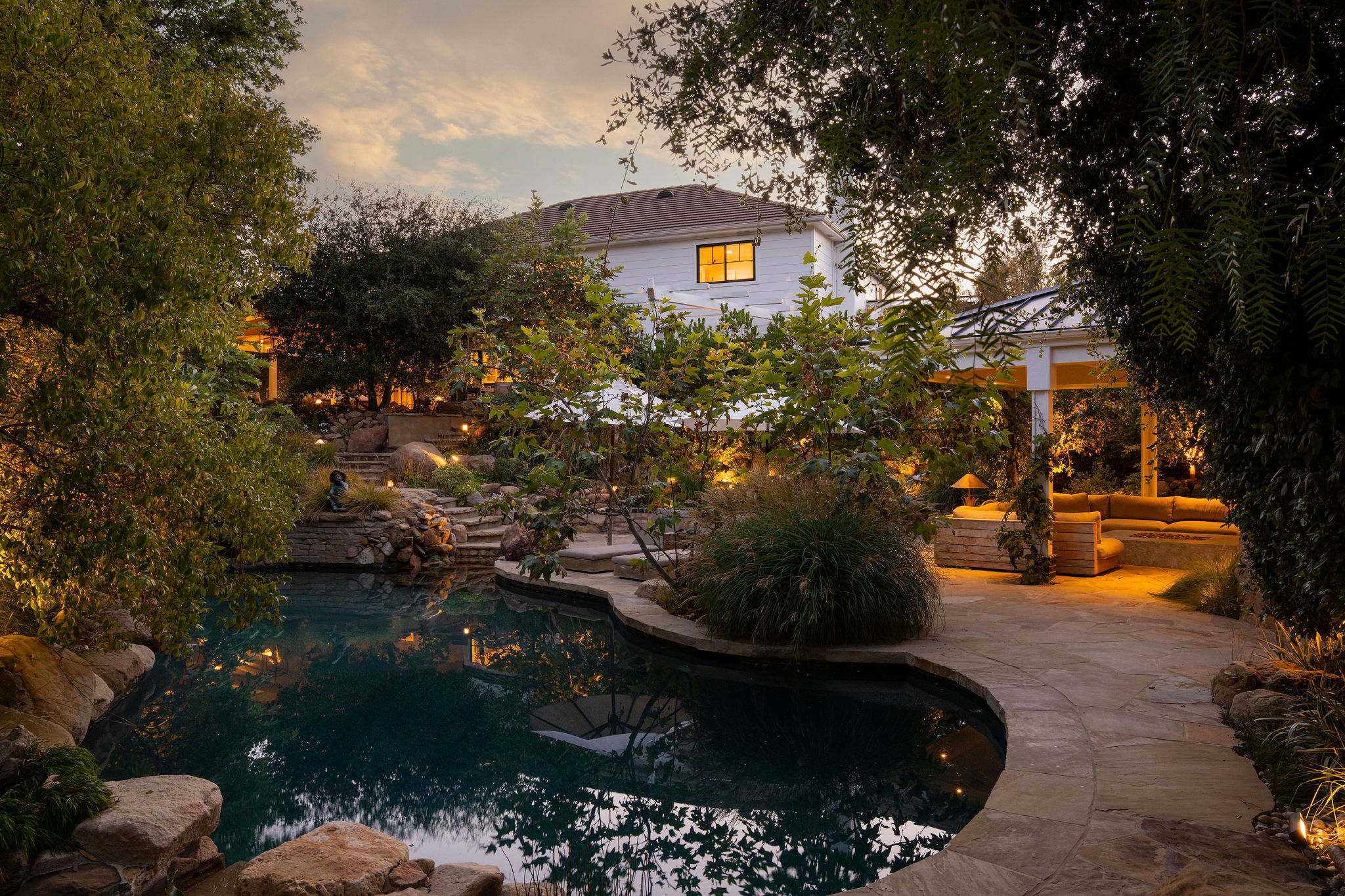 560 Cold Canyon Road Calabasas, CA 91302 - Photo 8 of 84 a view of a back yard of the house and a street view