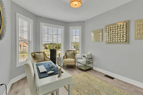 a living room with furniture and a window