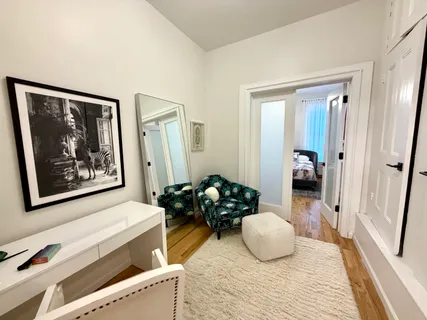 a room with furniture and wooden floor
