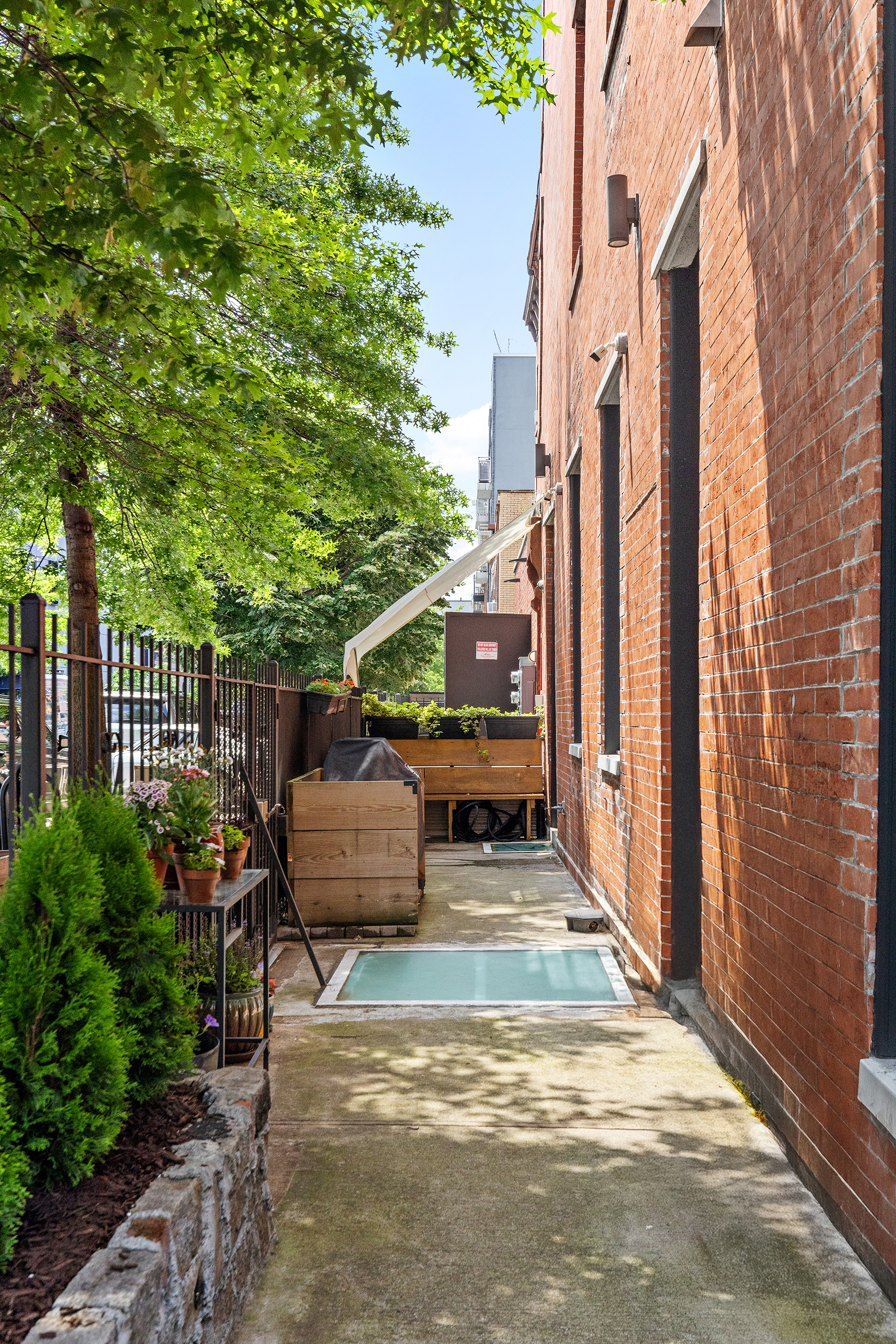 412 Classon Avenue Brooklyn, NY 11238 - Photo 25 of 30 a view of a patio with table and chairs and potted plants
