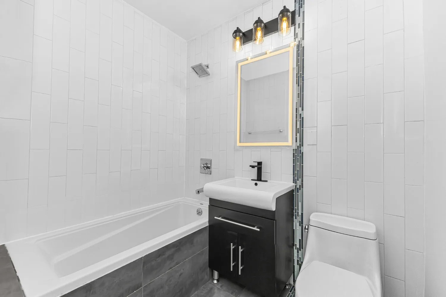 a bathroom with a sink a toilet and vanity