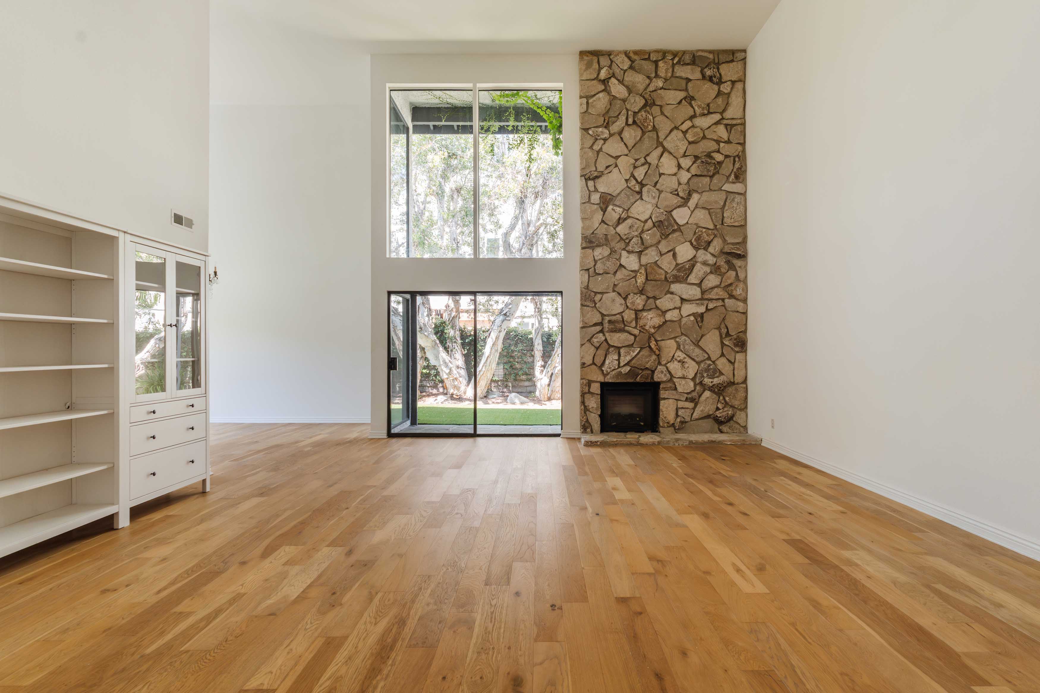 17273 Avenida De La Herradura Pacific Palisades, CA 90272 - Photo 4 of 23 an empty room with windows and fireplace