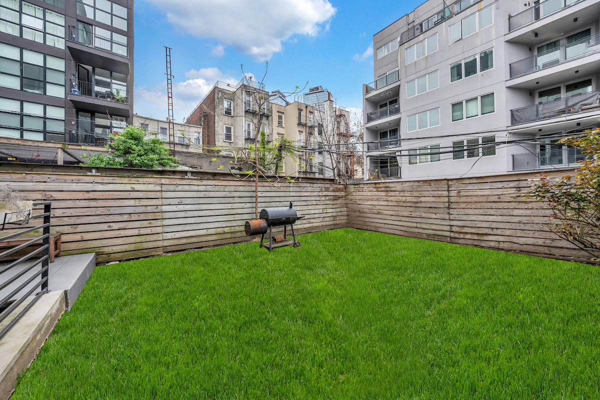 79 Clay Street, Unit 1R Brooklyn, NY 11222 - Photo 5 of 10 a view of building with yard