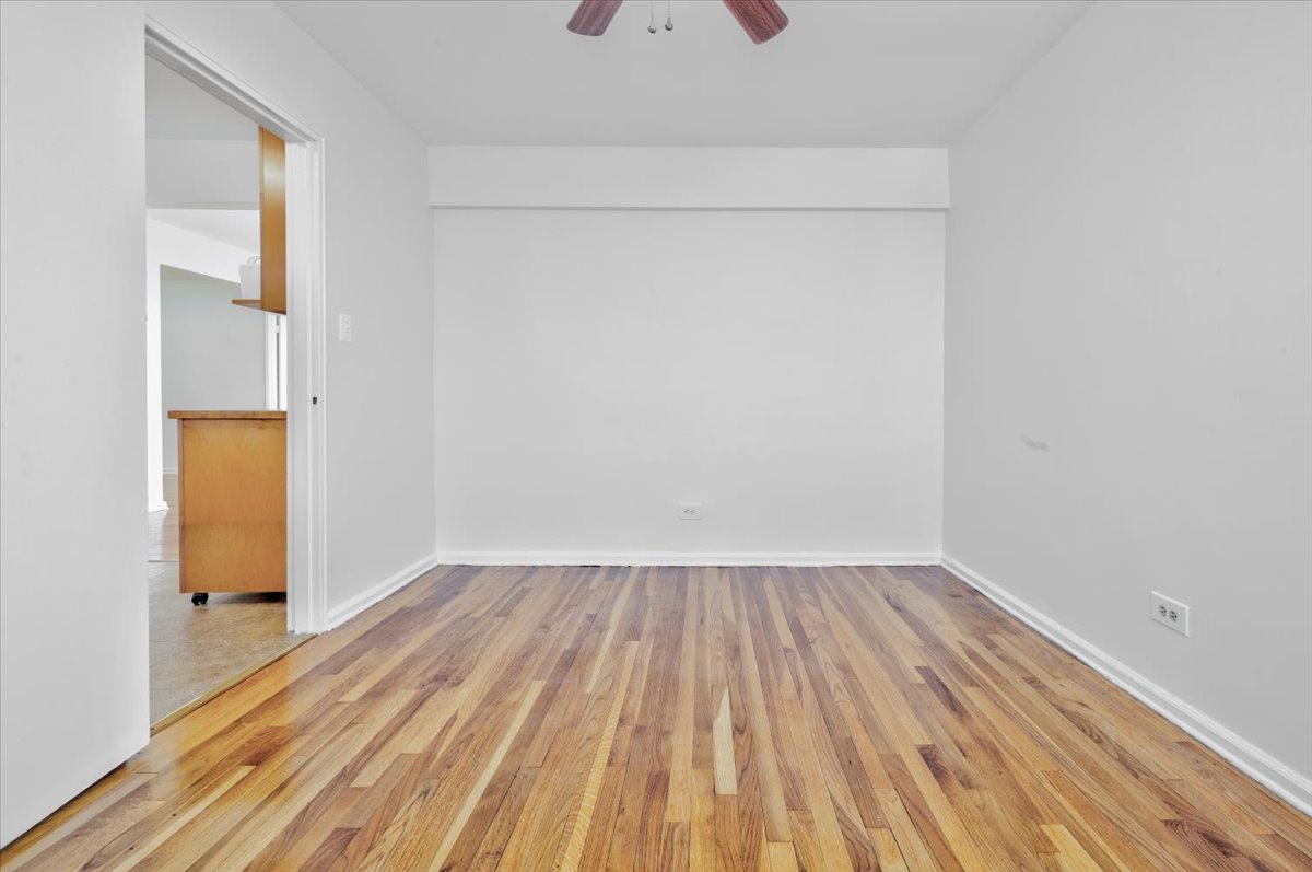 1270 East 51st Street, Unit 6X Brooklyn, NY 11234 - Photo 5 of 17 a view of a room with wooden floor and a sink