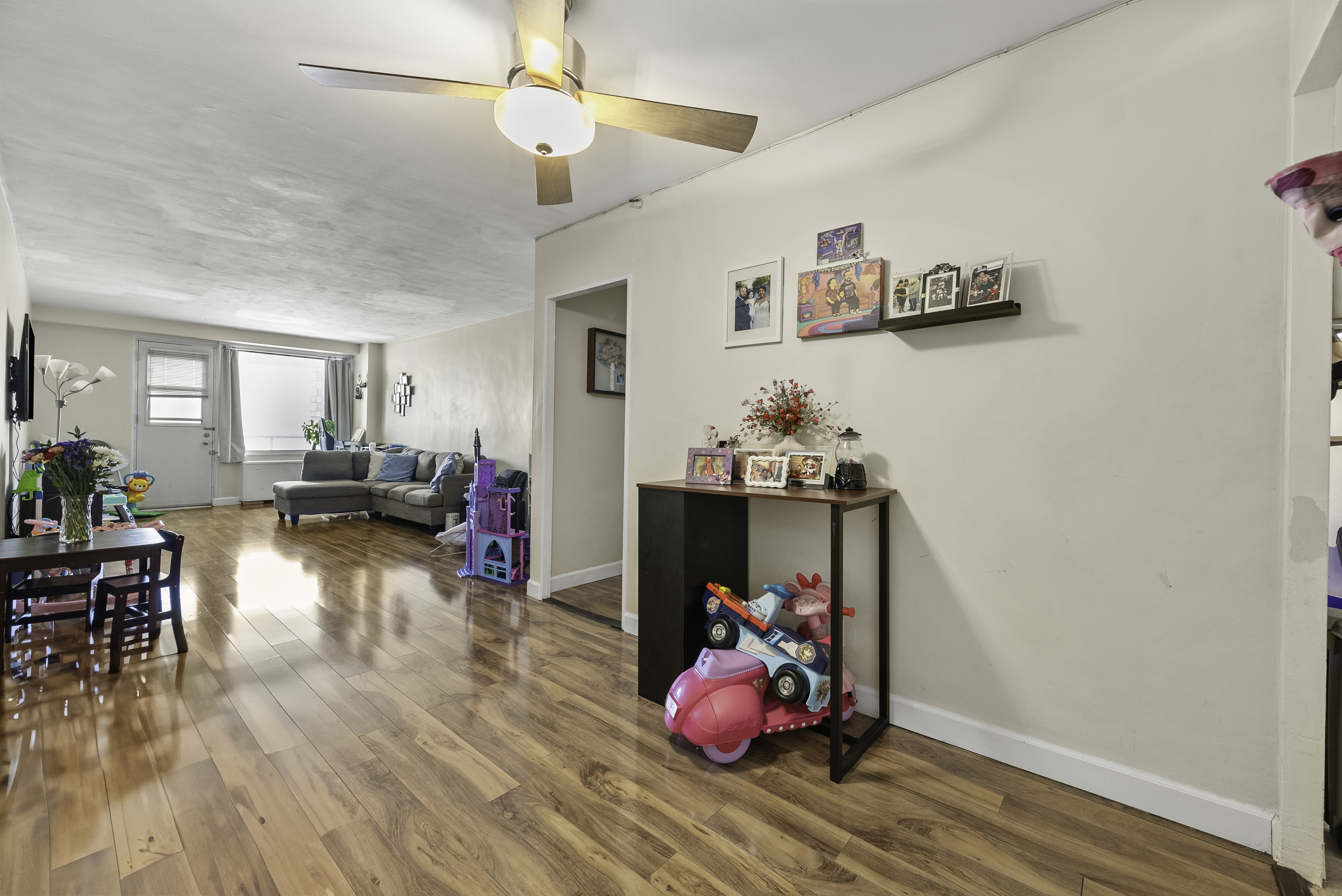 1020 Grand Concourse, Unit 5G Bronx, NY 10451 - Photo 3 of 11 a living room with furniture and a wooden floor