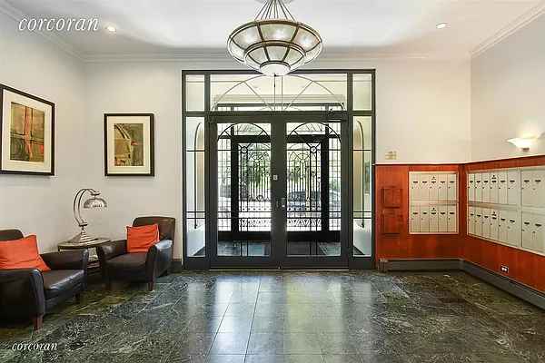 604 Riverside Drive, Unit 4E Manhattan, NY 10031 - Photo 6 of 8 a living room with furniture and a floor to ceiling window